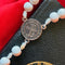White Beaded Rosary with Silver Accents